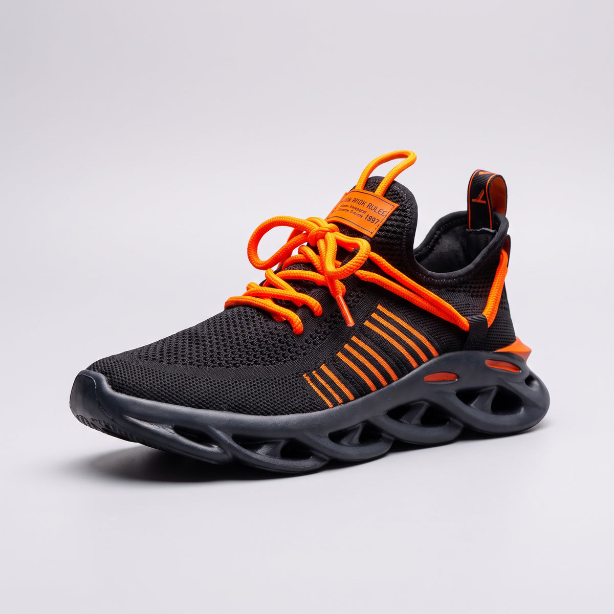 Bold Ranger sneaker in black and orange, three-quarter view