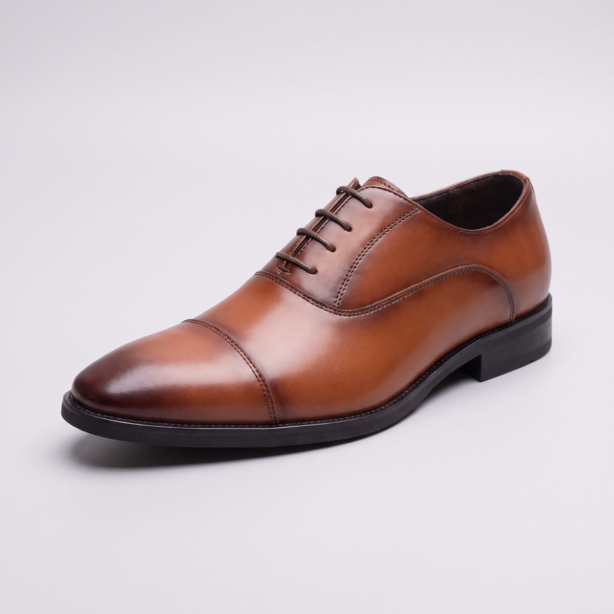 The Regent Oxford dress shoe in brown, three-quarter view
