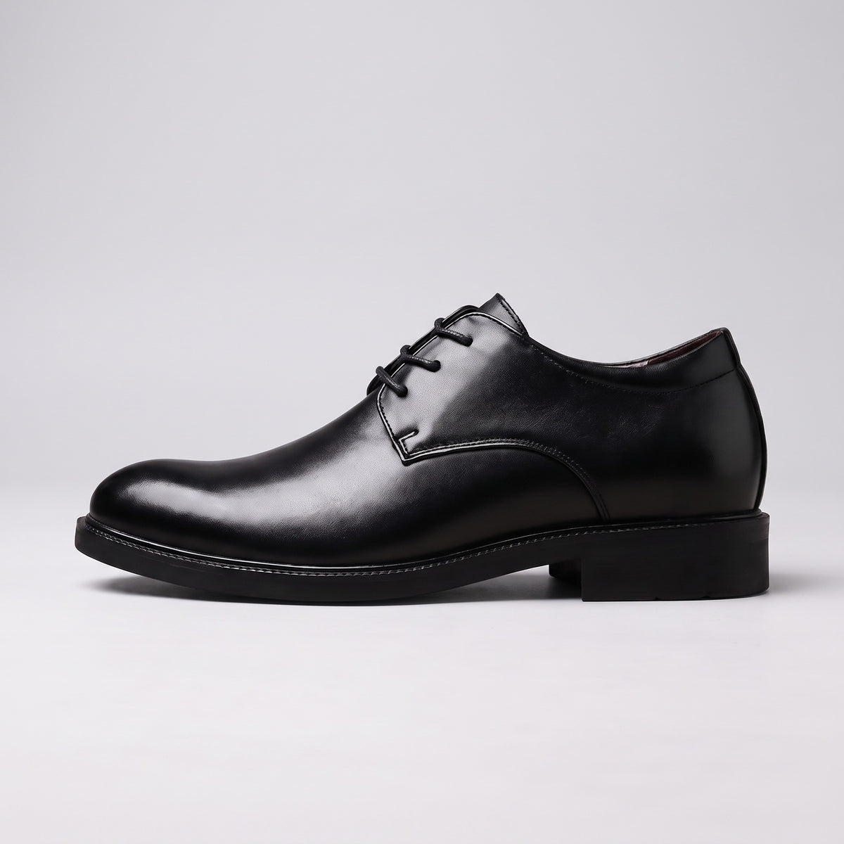 The Summit black leather derby, side profile on a pale grey studio background