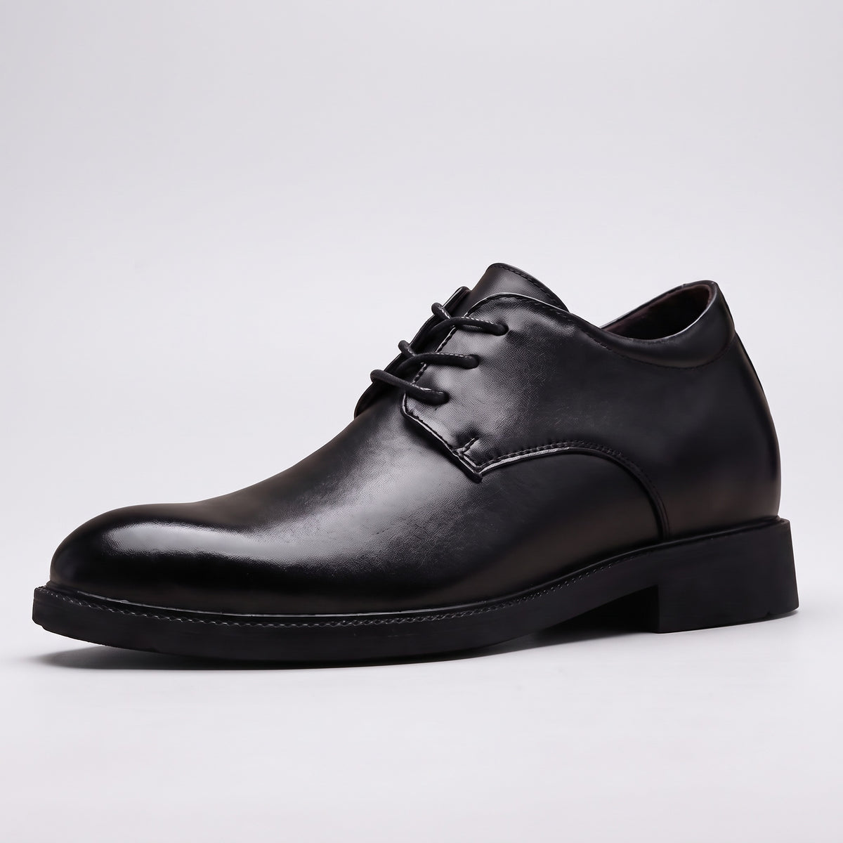 The Summit black leather derby dress shoe, three-quarter view on a pale grey studio background